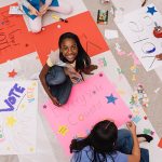 Girl Scouts make voting signs